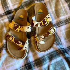 I’m selling these brown cow print sandals from MAUI ISLAND they are 7 in women’s